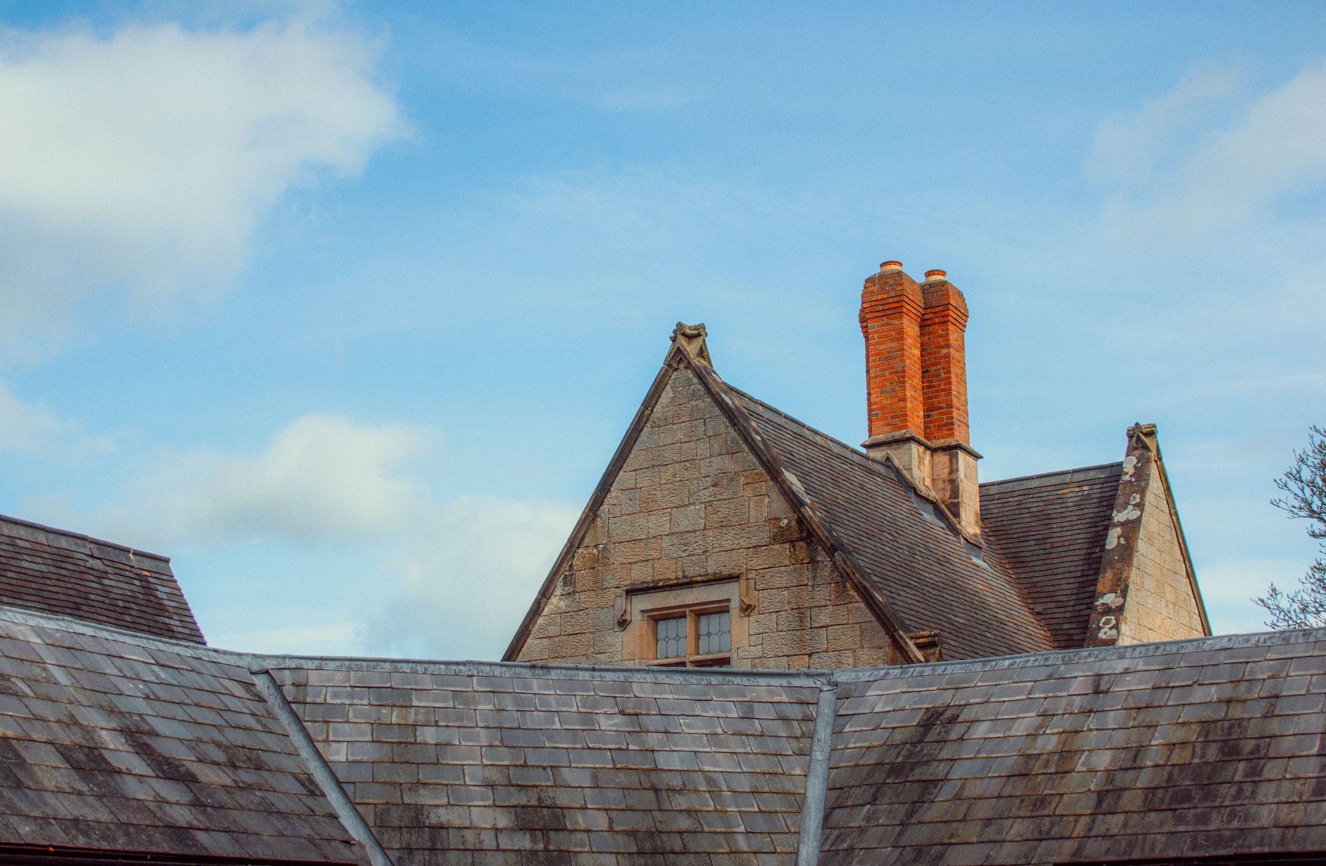 Stone house with brick chimney stack